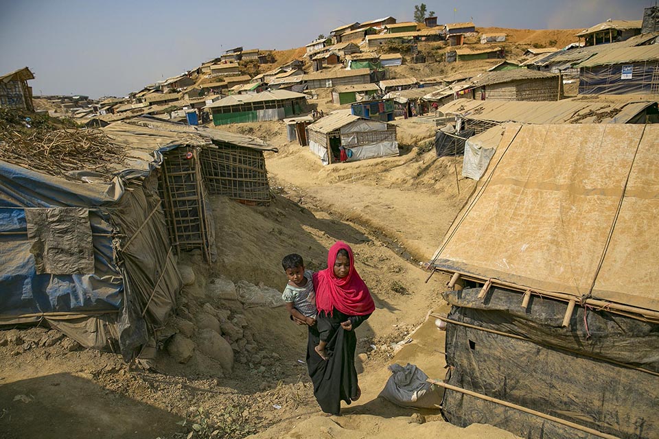 Minara Begum, 22, is seen with her child in Balukhali camp March 5, 2018 in Cox's Bazar, Bangladesh.    Photo: UN Women/Allison Joyce