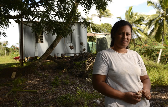 Market vendor Sofia Talei at her farm in Tailevu, Fiji. Her crops were severely damaged by Tropical Cyclone Winston and it will take at least four months to re-grow even the fast-growing plants. “We placed so much expectation on our farm to help us pay for our expenses, including my children's education and medicine. We need to salvage what we can to help us cover our expenses.” Photo: UN Women/Eva Schroeder