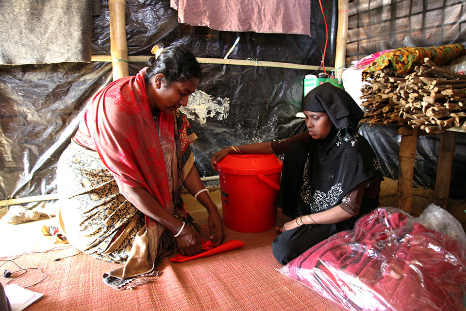 Rohingya women in Cox's Bazar receive dignity kits from UN Women, in partnership with the Ministry of Women and Children Affairs and ActionAid Bangladesh. Photo: ActionAid Bangladesh/Md. Sariful Islam