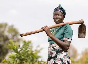 Florence Driciru, a farmer and a mother of five, has improved her crop yield using climate smart agriculture. Photo: UN Women/Jeroen van Loon