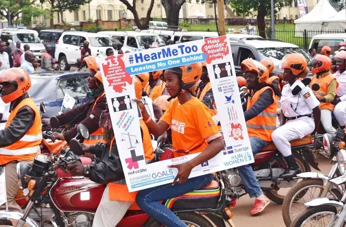Ugandan police join UN Women Uganda as part of the 'Orange the World' campaign to end violence against women and girls. Through its global program Women Count, UN Women’s data collection and analysis has led to policies to address violence against women in Uganda and several other countries. Photo: UN Women/Martin Ninsiima