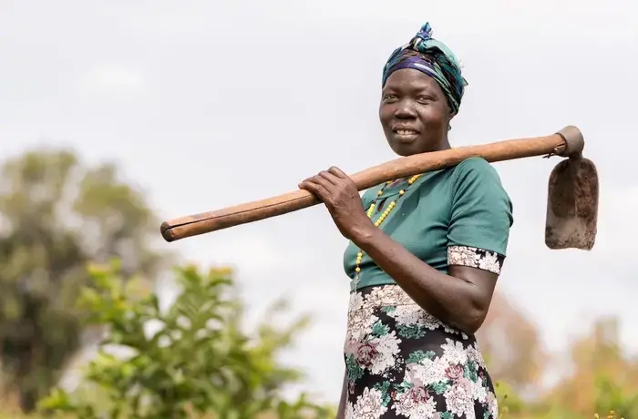 Florence Driciru, a farmer and a mother of five, has improved her crop yield using climate smart agriculture. Photo: UN Women/Jeroen van Loon