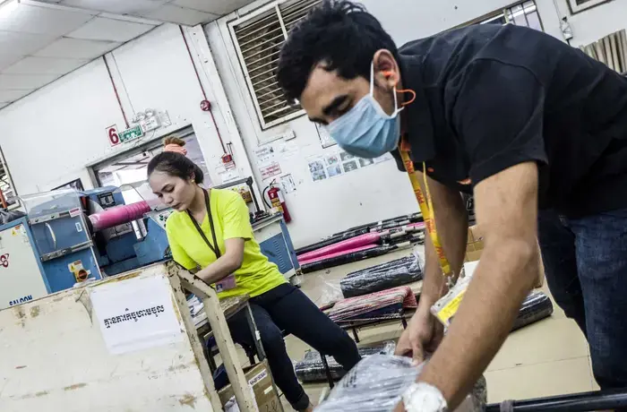 Garment factory workers in Sangkat Chaom Chao, Cambodia. The factory is at the forefront in addressing and fighting sexual harassment in the work place. Photo: UN Women/Charles Fox.