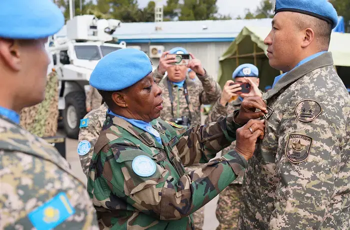 Head of Mission and Force Commander Major General Anita Asmah presents the first Kazakhstan contingent at UNDOF with their UNDOF medals on 7 February 2025. Photo: UNDOF