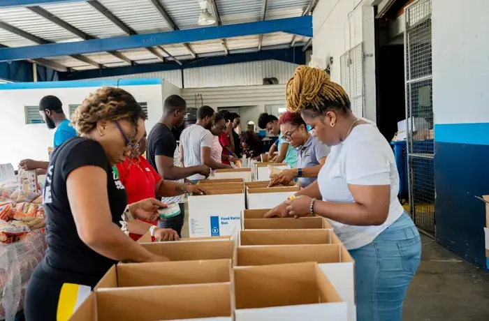 WFP volunteers packing relief supply boxes