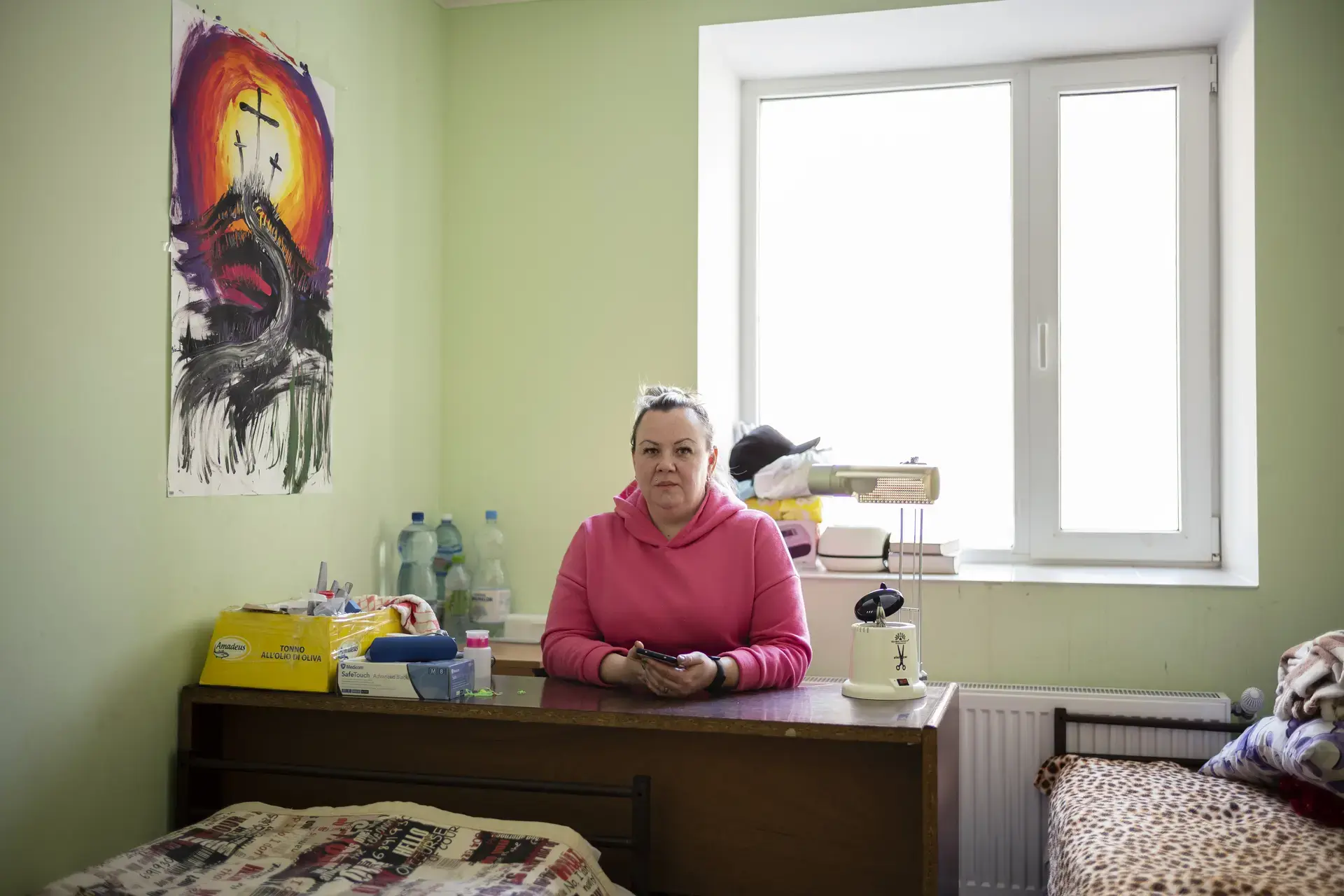 Marina, nail-artist from Odessa, at her work station in the temporary placement center in Vatici, Orhei district, Moldova. 