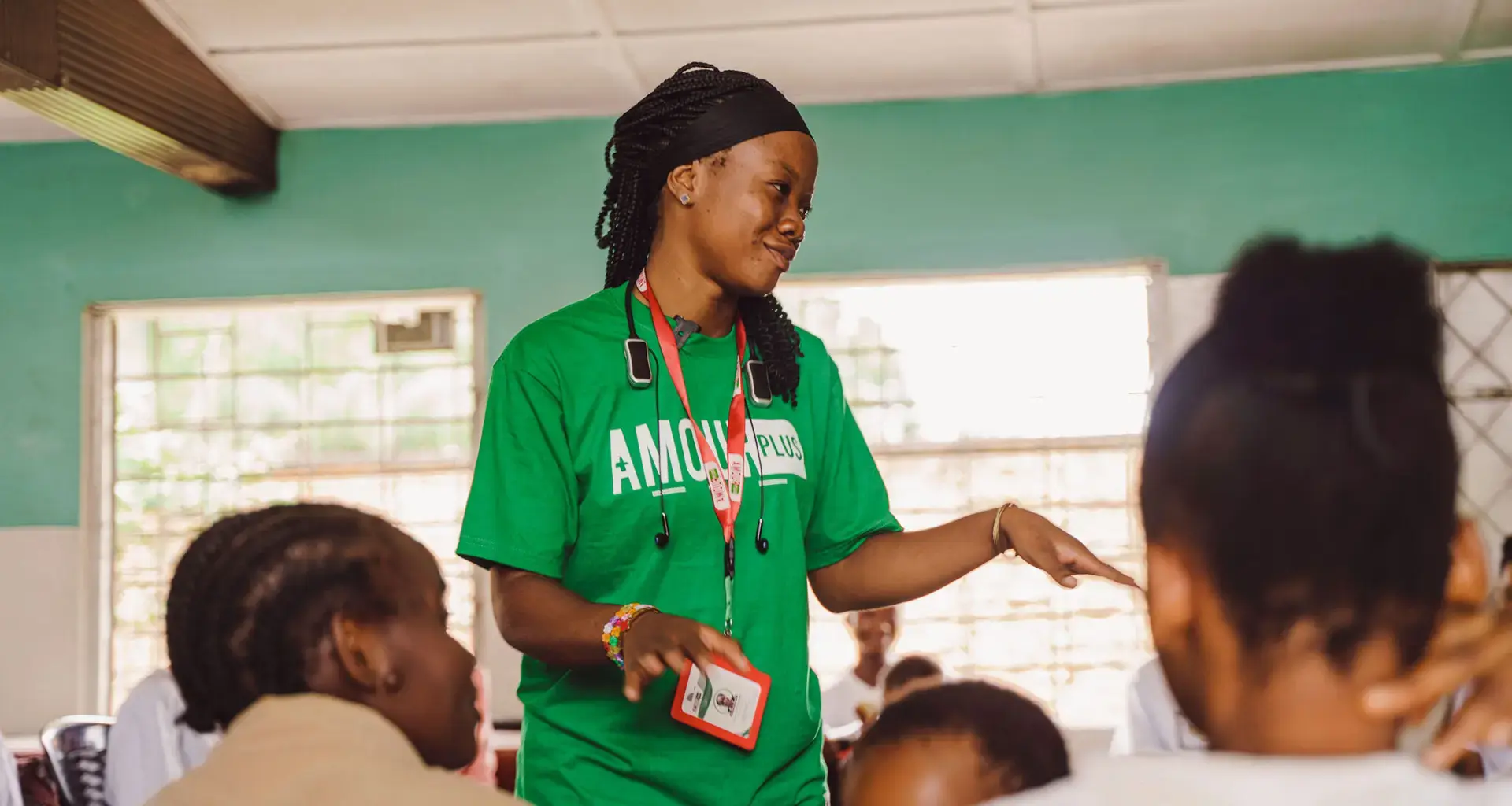 A woman stands to address a group of people