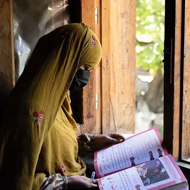 Women learn to read and write through a literacy initiative supported by UN Women, in Nuristan province, eastern Afghanistan. As part of the initiative, 130 Village Literacy Committees were also established, to help reach vulnerable women and girls, particularly in more remote communities. By improving their literacy, the women can also strengthen their livelihoods and build their resilience, in one of the most isolated and underserved provinces in Afghanistan. Photo: UN Women/Sayed Habib Bidell