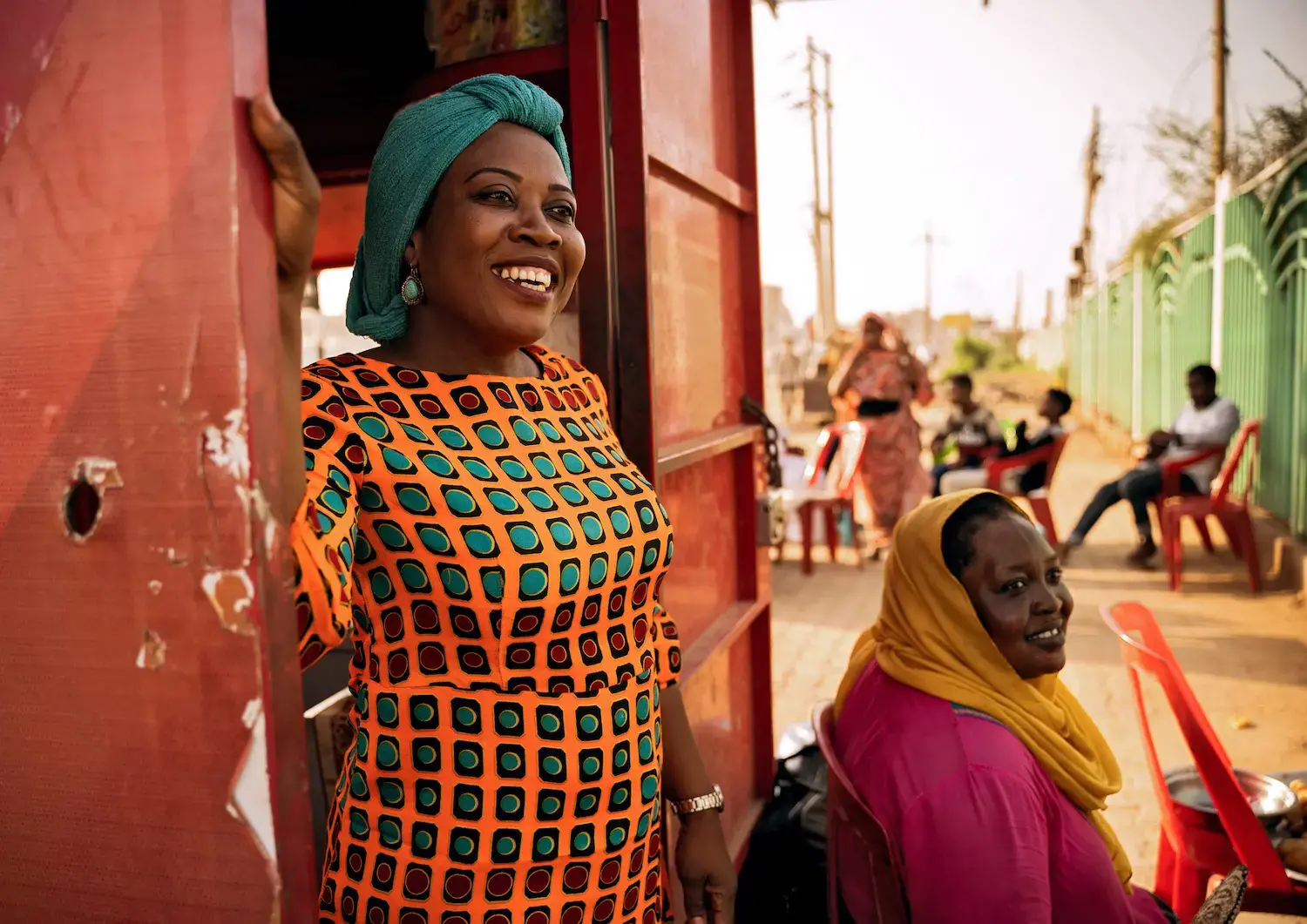 Gender specialist Hawa Games Dahab Gabjenda stands in a doorway.