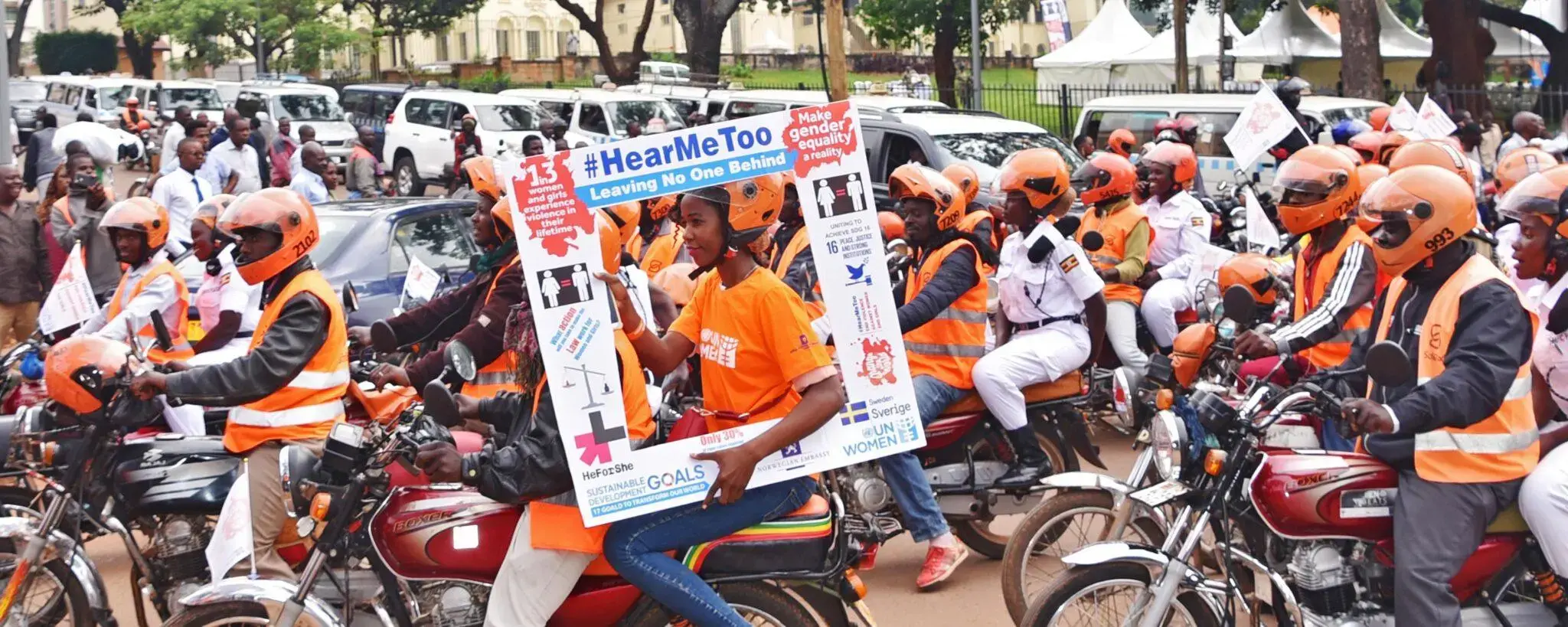 Ugandan police join UN Women Uganda as part of the 'Orange the World' campaign to end violence against women and girls. Through its global program Women Count, UN Women’s data collection and analysis has led to policies to address violence against women in Uganda and several other countries. Photo: UN Women/Martin Ninsiima
