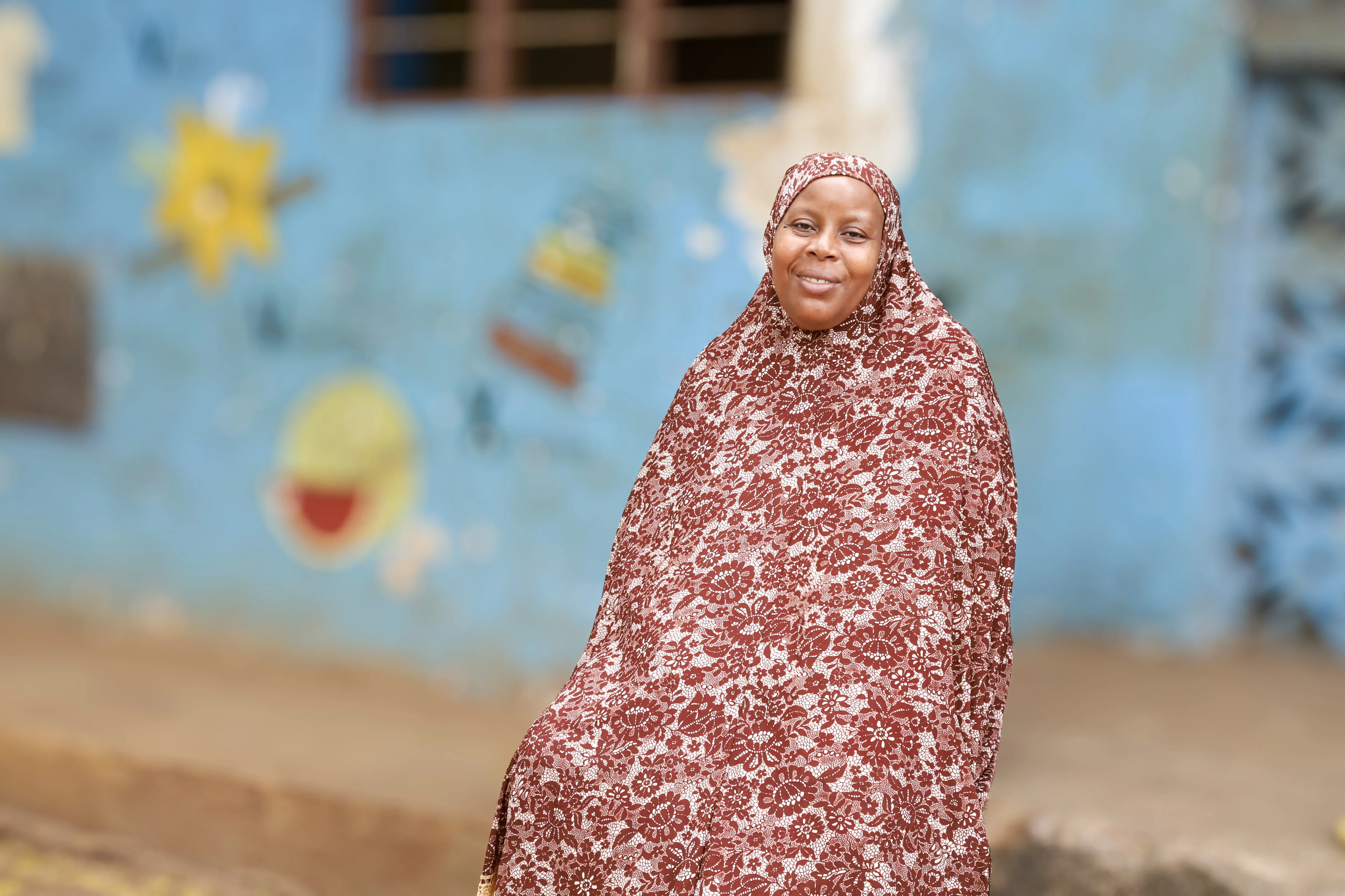 Munira Abdallah Abdallah in front of the childcare centre. Photo: UN Women