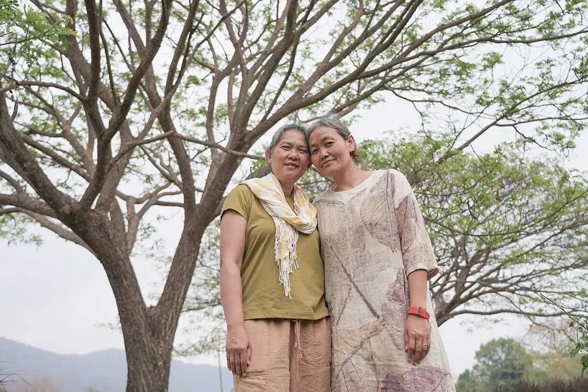 Veerawan and Matcha pose for a portrait together