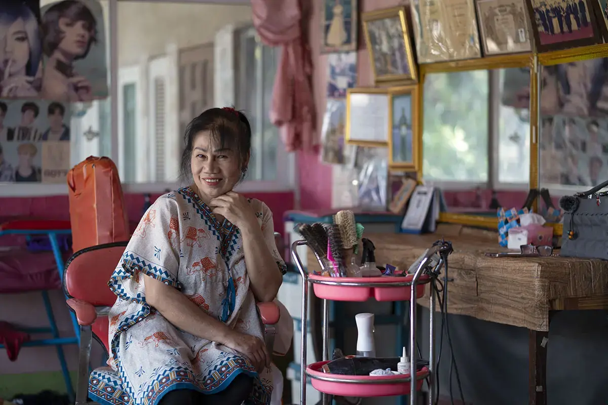 Seated inside her beauty salon, Ngern radiates warmth with a gentle smile. 13 March 2025, Chiang Khong District, Chiang Rai Province.