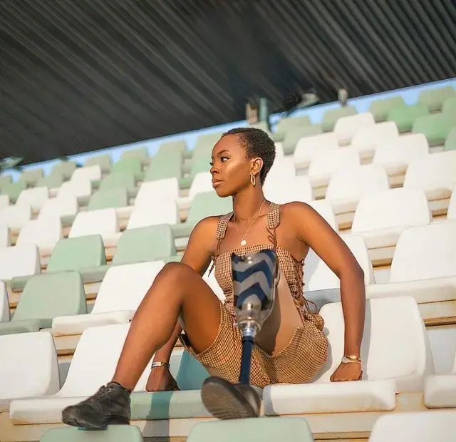 Eva Chisom reclaims public space through fashion and presence, using her prosthetic limb as a bold expression of power and identity. The image is part of her ongoing visual storytelling series, The Body as Canvas. Photo: Collins Osho